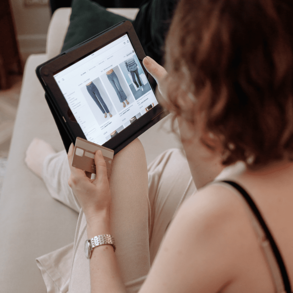 An image of a person using a mobile device for online shopping, symbolizing the rise of digital transformation in retail