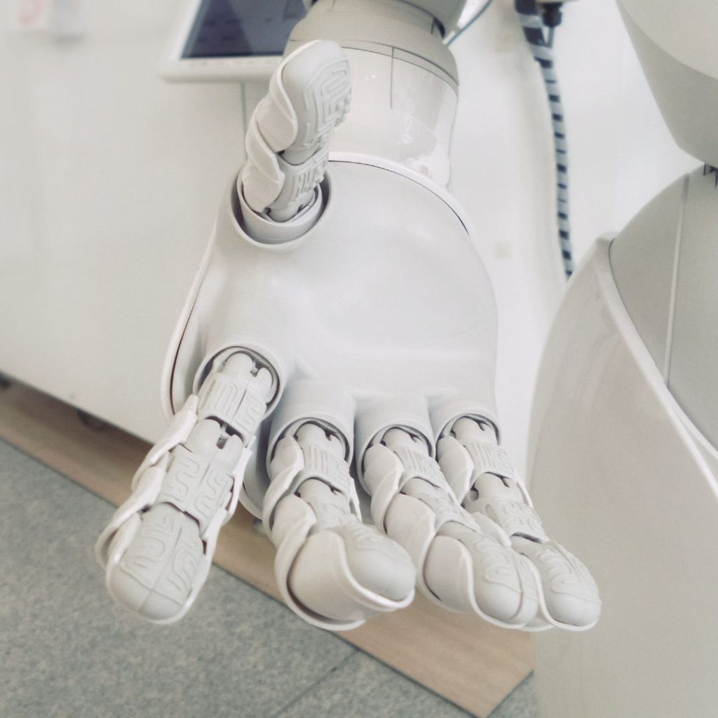 Robot hand symbolizing the technological advancements in legacy application modernization.